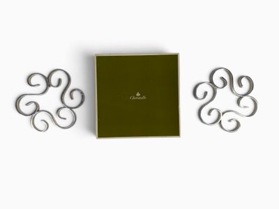 a close up of a book with a green cover and two metal letters