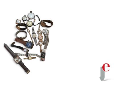 a lot of watches and a pen on a white surface