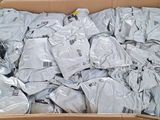 a cardboard box filled with a large amount of clothing