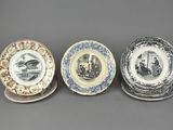 three plates with different designs on them sitting on a table