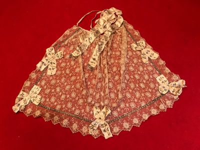 a red and white dress on a red surface