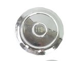 a close up of a silver plate on a white surface