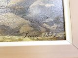une photo d'un tableau représentant un paysage de montagne, dans un cadre