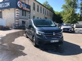 a black van parked in front of a building