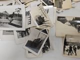 many old black and white photos on the table