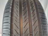 a close up of a tire on a white surface