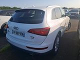 a white car that is parked in a parking lot