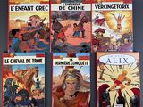 the covers of the comics are all different colors and sizes