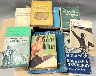 several books are stacked on top of each other on a table