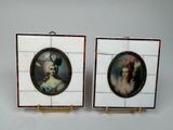 pair of miniature portraits of a woman and a man on a tile wall