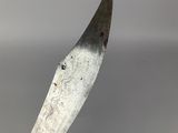 a large knife that is sitting on top of a table