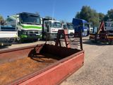 many trucks that are parked next to each other