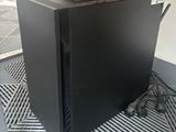 a black computer case sitting on the floor in a room