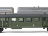 four green train cars sitting next to each other on a white surface