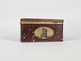 an old tin box with a picture of a man on it