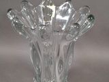 a glass vase that is sitting on a table