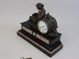 a clock that is sitting on top of a table