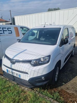 the white van is parked next to the white van