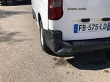 a white van that is parked on the side of the road
