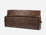 an old wooden chest with carvings on the sides