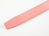 a close up of a pink belt on a white surface