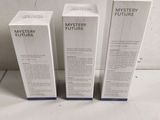 three boxes of mystery future perfume sitting on top of a table