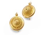 an image of a pair of gold earrings on a white background