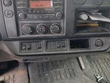 a dashboard of a car with a radio and a steering wheel