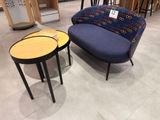 two chairs and a table in a store