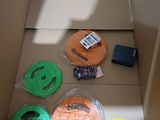 a cardboard box with a bunch of different items inside of it