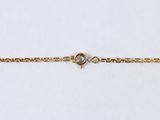 a close up of a gold chain with a clasp on it