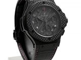 the watch is black and has a pink band