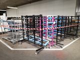 many carts that are lined up in a warehouse