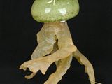 a lamp that is shaped like a jelly with a leaf on it