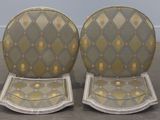 pair of round chairs with gold and silver patterned upholstered seats