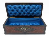 a wooden box with a blue velvet lining inside