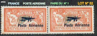 two stamps with a picture of an airplane on them on a black surface