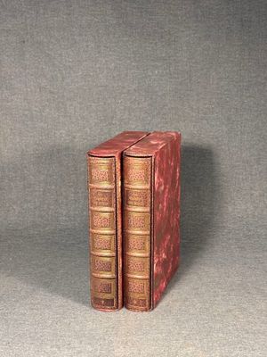 two books sitting on top of each other on a table