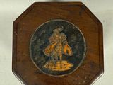 a small wooden box with a picture of a man on it