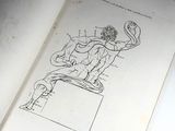 a book with a drawing of a man sitting on a chair