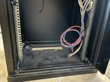 a close up of a metal cabinet with wires in it