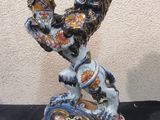 a figurine of a lion on a black table