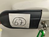 a hand that is holding a cell phone with a sticker on it