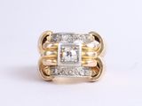 an image of a gold and diamond ring on a white background