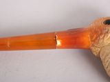 a pipe that is sitting on a white surface