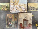 four paintings on a table with a clock and pictures on it