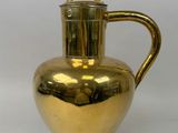 brass plated pitcher with handle on a white background