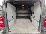 a white van with the back door open and a ramp in the back of the van