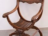 a wooden chair that is sitting in a room