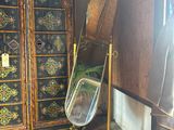 a cabinet with a mirror on top of it in a room